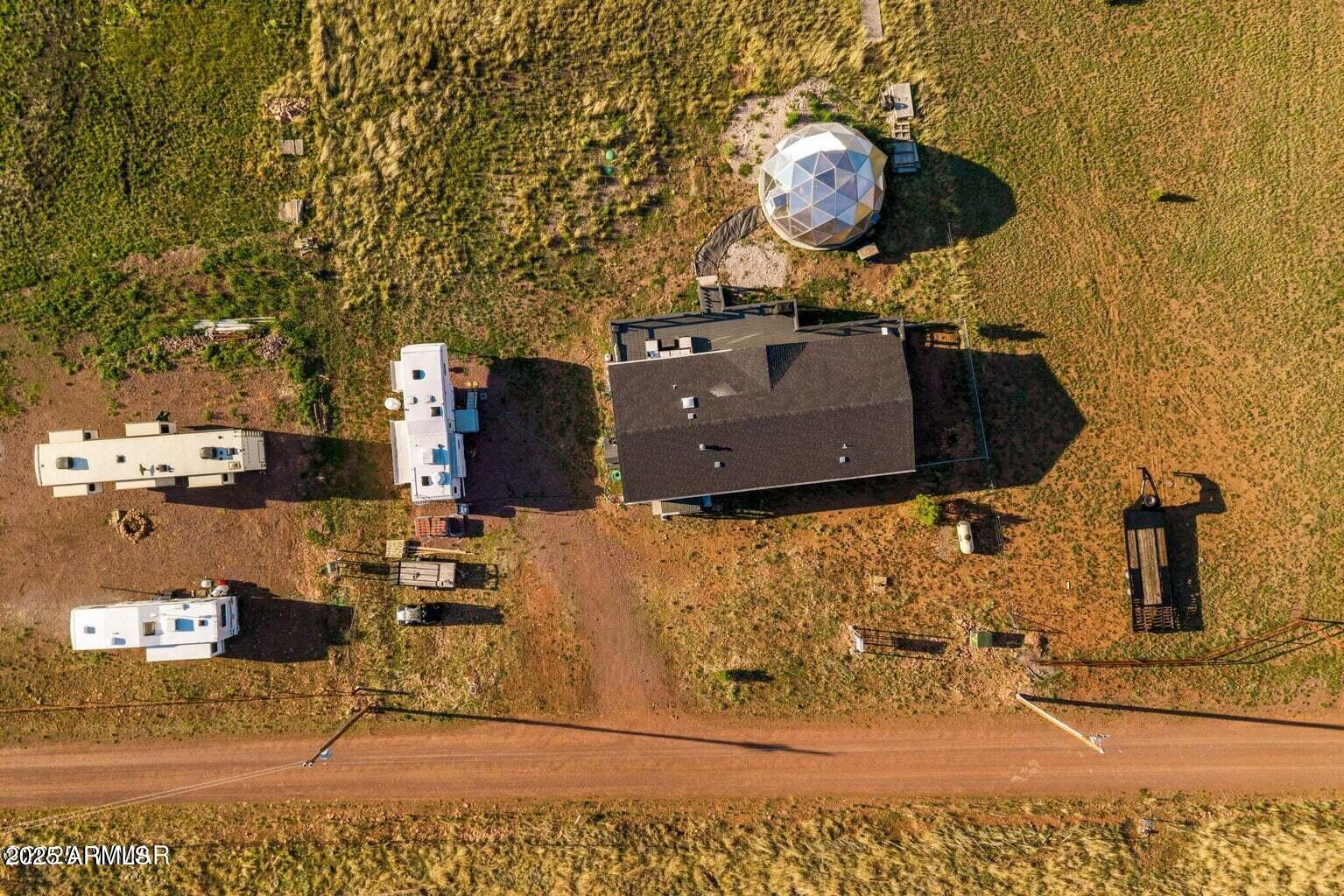 53 County Road 2092 Alpine, AZ 85920 - Photo 32 of 36 an aerial view of a house with a backyard