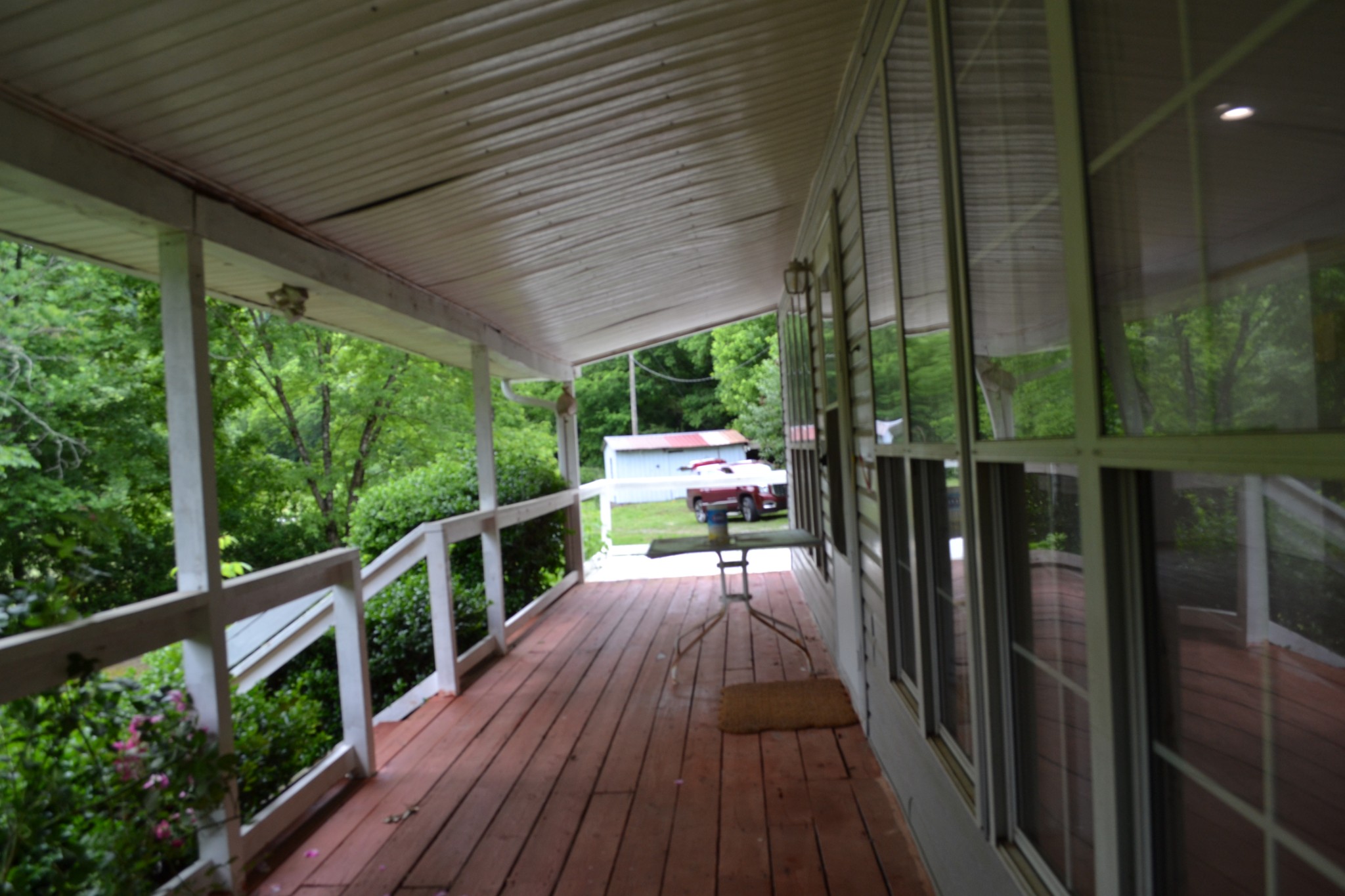 1505 Add Stafford Road Hilham, TN 38568 - Photo 40 of 65 a view of a balcony with chairs and wooden floor