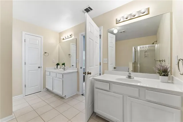 a bathroom with a double vanity sink mirror and double