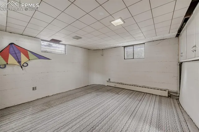 a view of a room with wooden floors