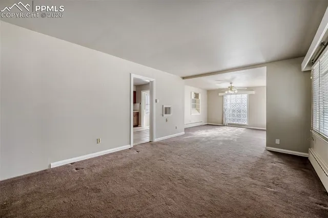 a view of an empty room with a bathroom