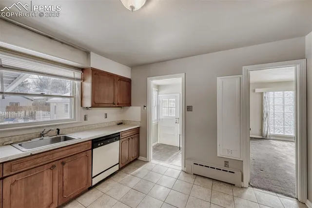 a kitchen with a sink and cabinets
