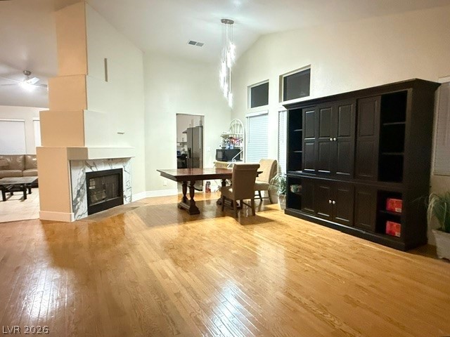 804 Rancho Coast Way Henderson, NV 89002 - Photo 8 of 20 Gleaming hardwood floors and a modern fireplace anchor this vaulted living space.