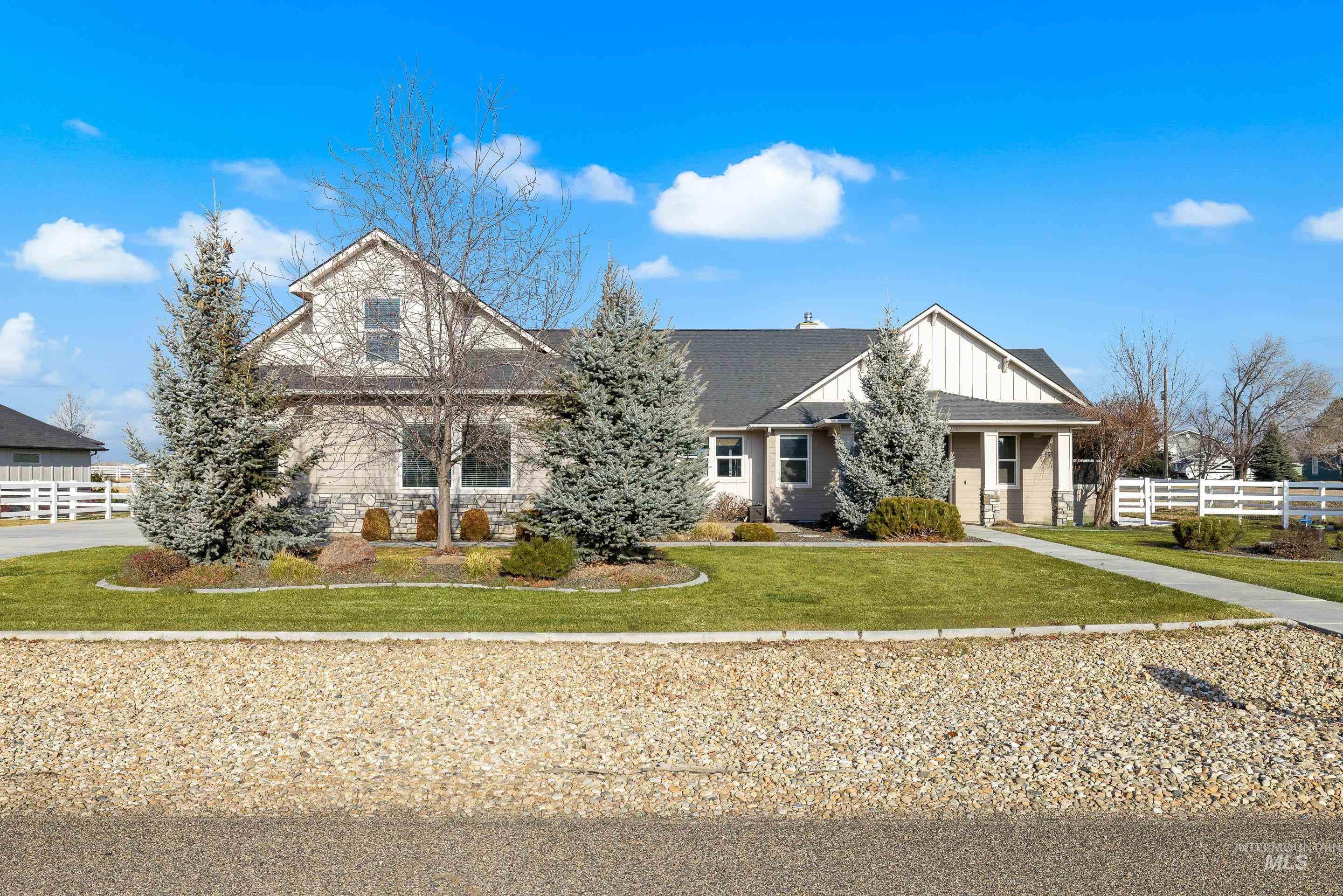 View of front of property with board and batten siding