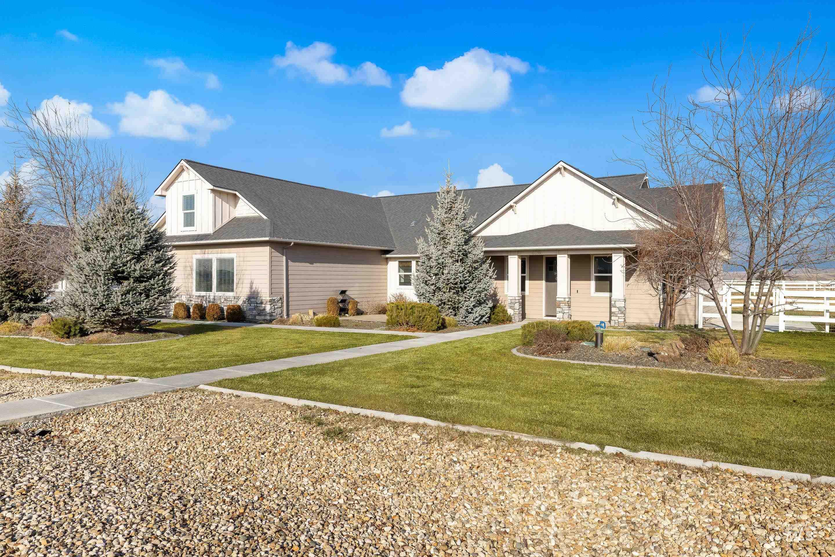 8018 Plumberry Court Middleton, ID 83644 - Photo 2 of 50 View of front of house featuring a front lawn, a porch, and roof with shingles