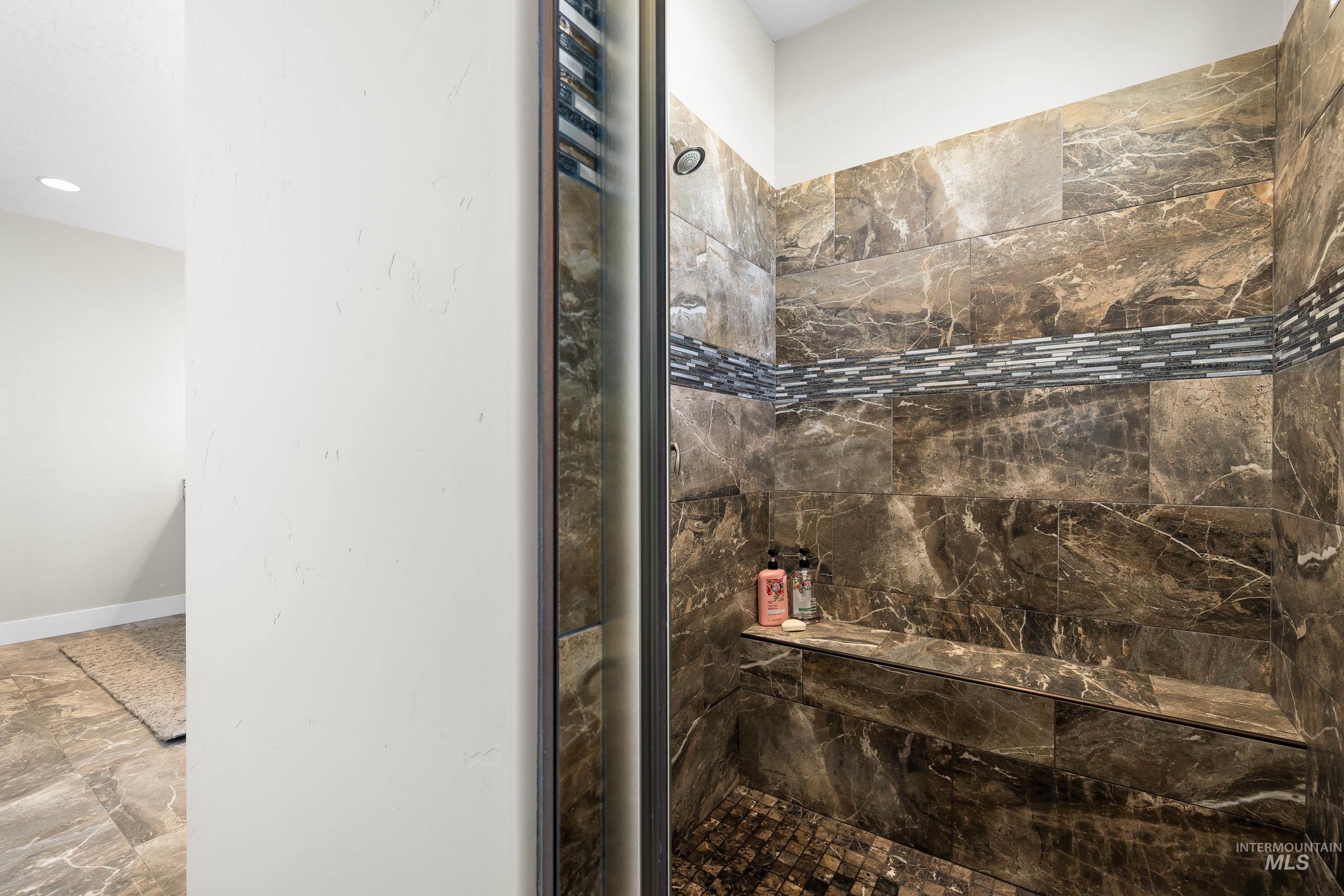 8018 Plumberry Court Middleton, ID 83644 - Photo 34 of 50 Full bath with tiled shower and baseboards