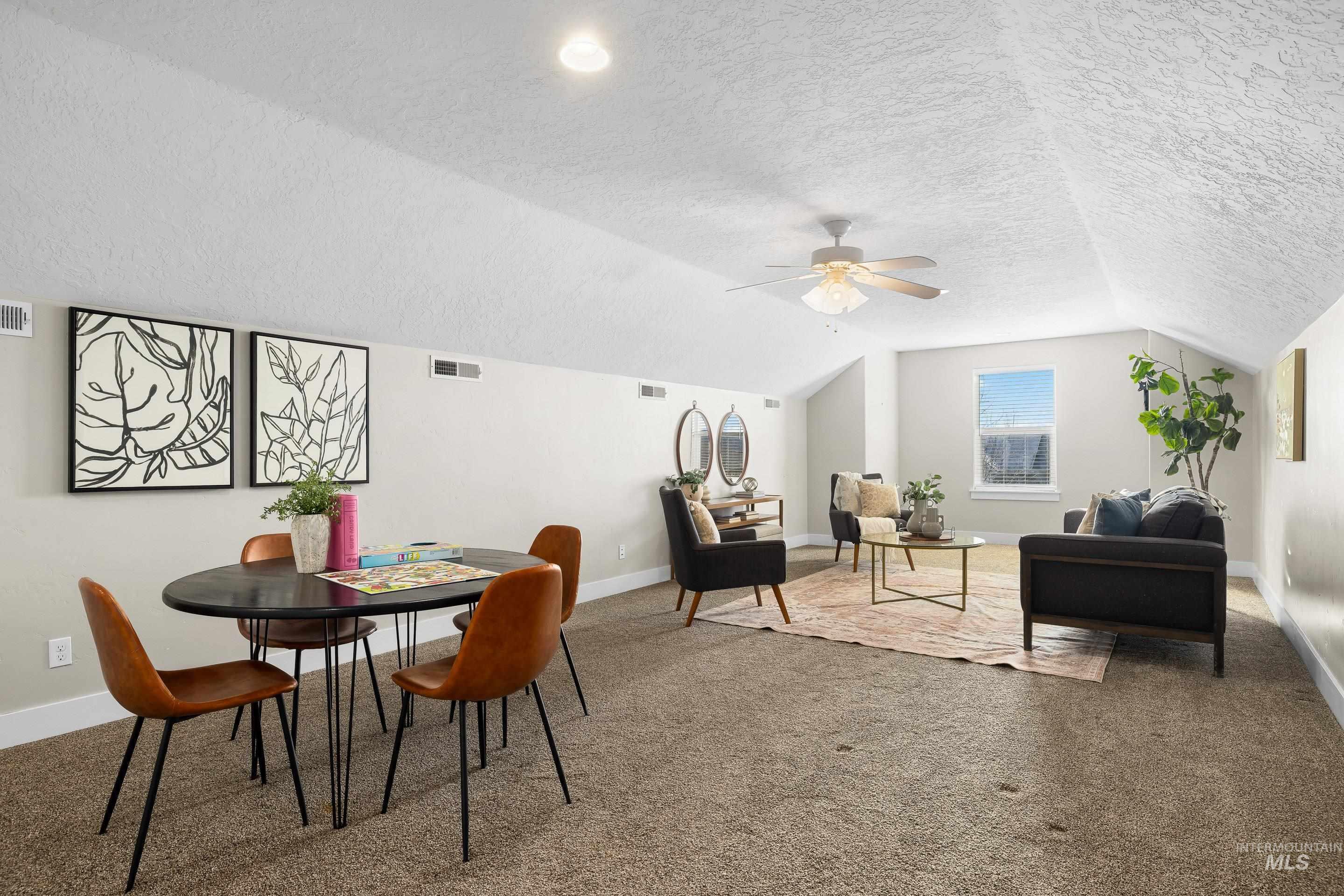 8018 Plumberry Court Middleton, ID 83644 - Photo 35 of 50 Carpeted dining space with lofted ceiling, a textured ceiling, and ceiling fan