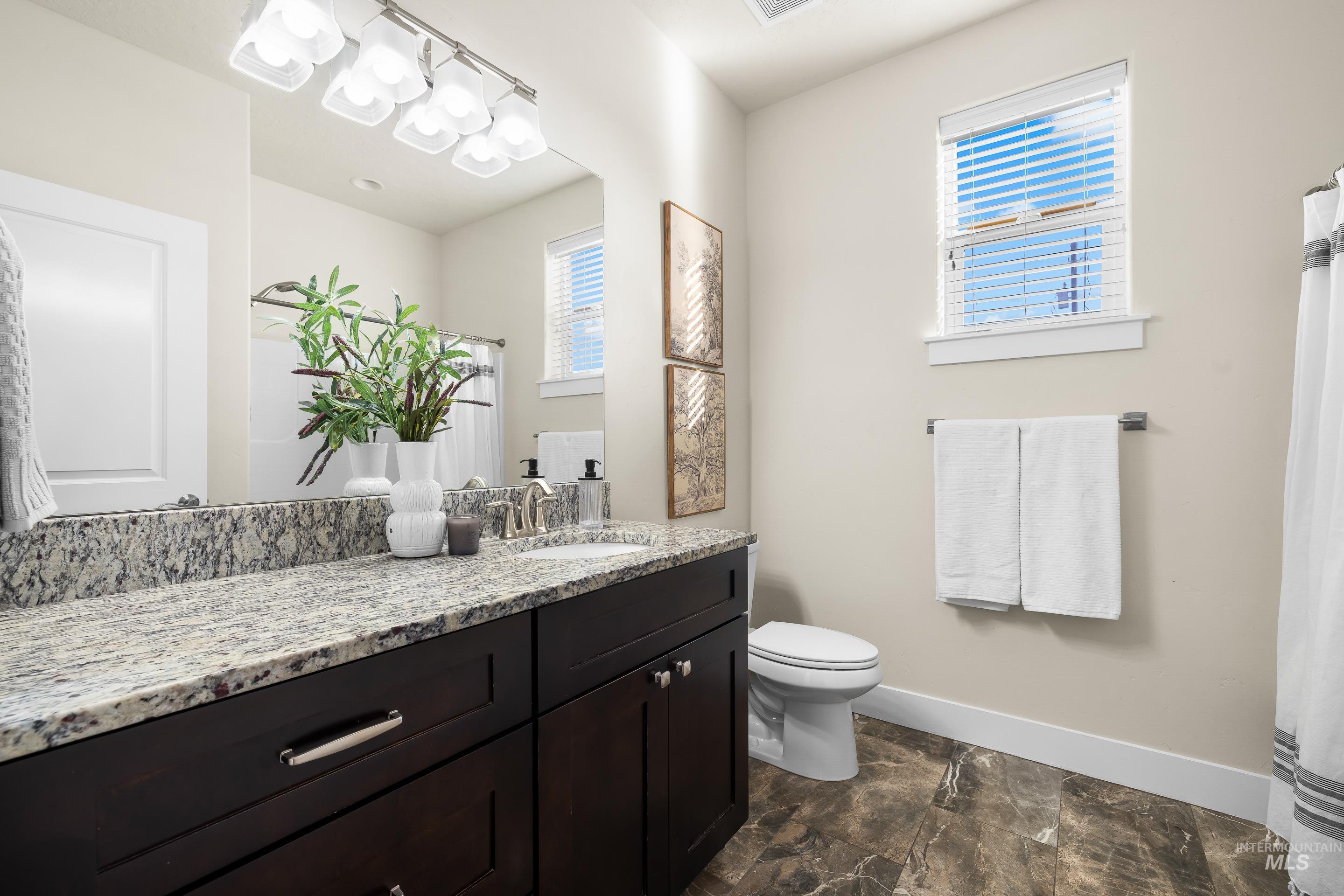 8018 Plumberry Court Middleton, ID 83644 - Photo 39 of 50 Bathroom featuring vanity and a shower with shower curtain