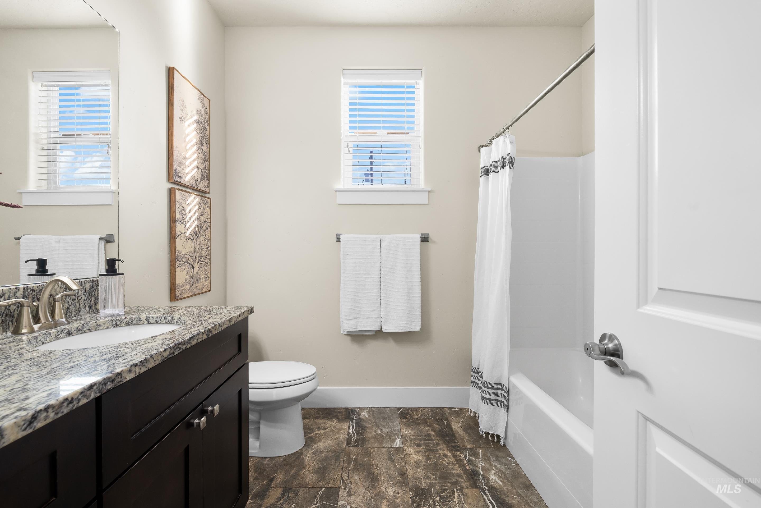 8018 Plumberry Court Middleton, ID 83644 - Photo 40 of 50 Full bathroom featuring shower / bathtub combination with curtain and vanity