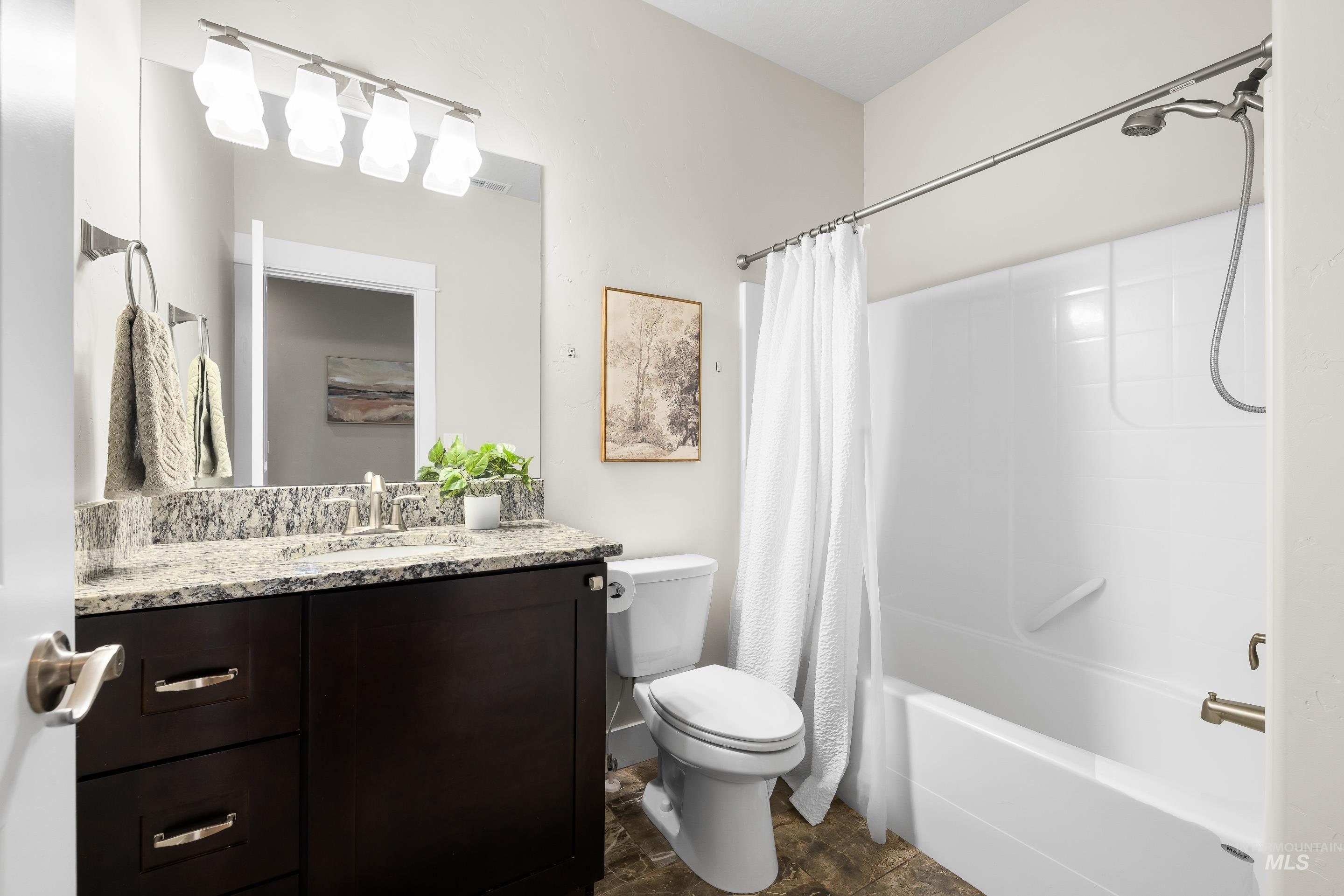 8018 Plumberry Court Middleton, ID 83644 - Photo 42 of 50 Bathroom featuring shower / bathtub combination with curtain and vanity