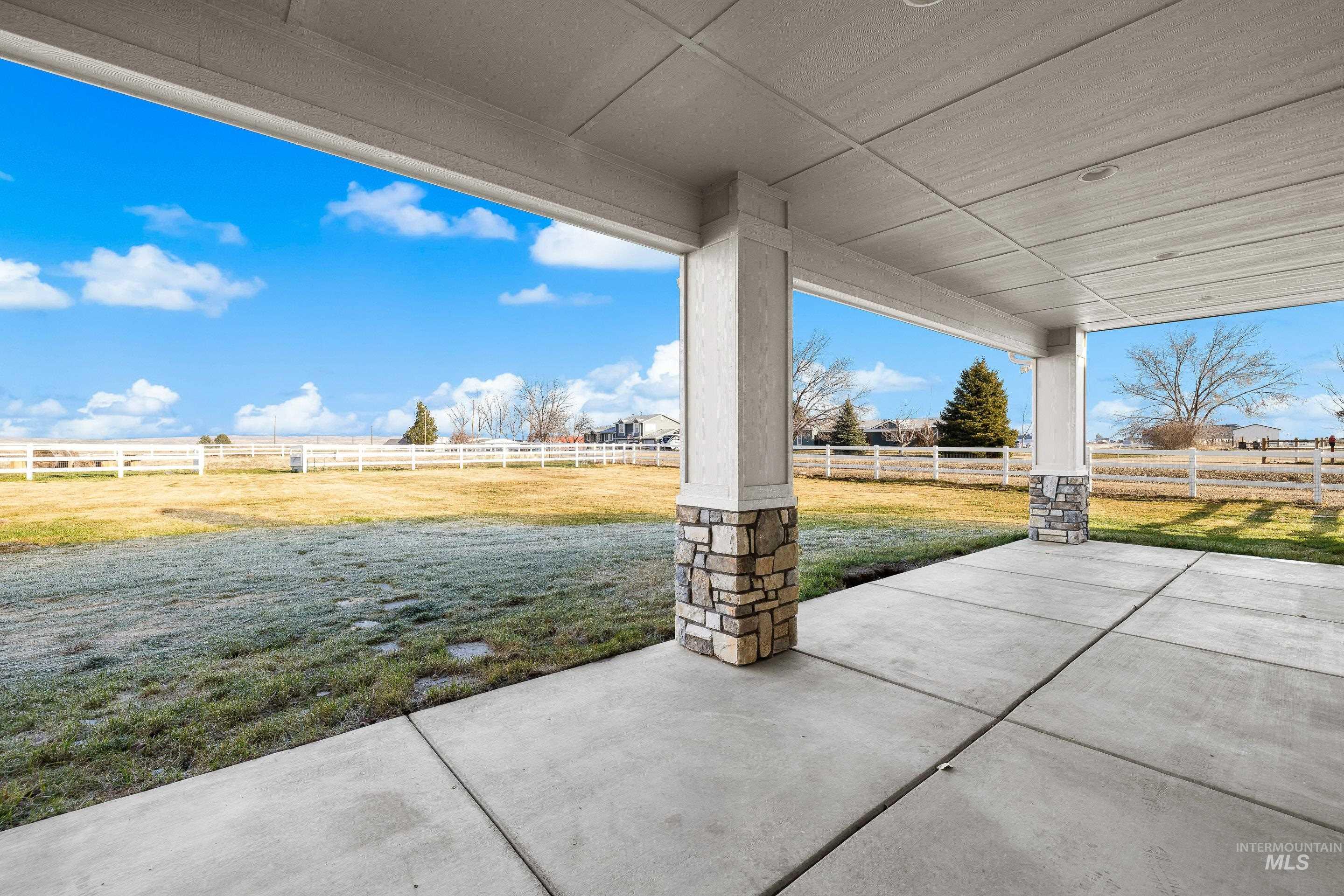 8018 Plumberry Court Middleton, ID 83644 - Photo 44 of 50 Fenced backyard featuring a patio area and a view of countryside