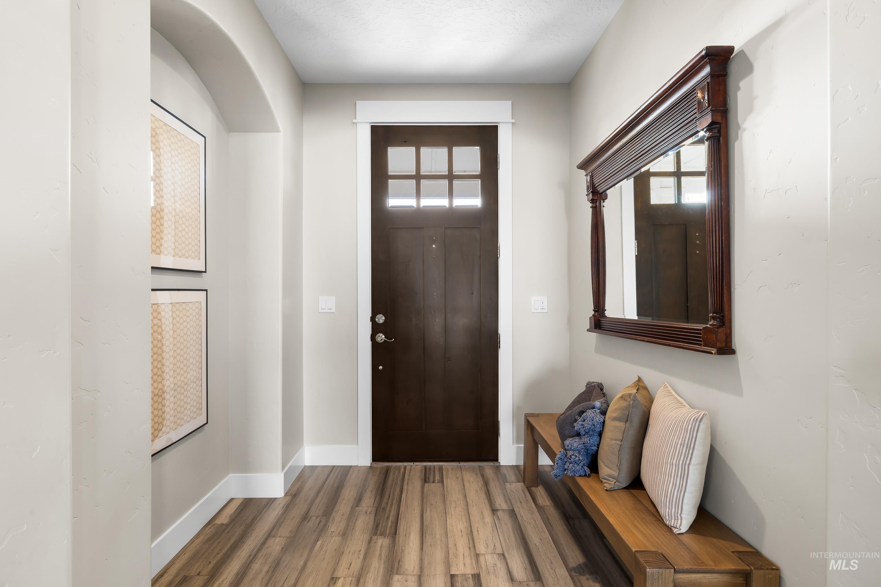 8018 Plumberry Court Middleton, ID 83644 - Photo 5 of 50 Entryway with healthy amount of natural light and wood finished floors