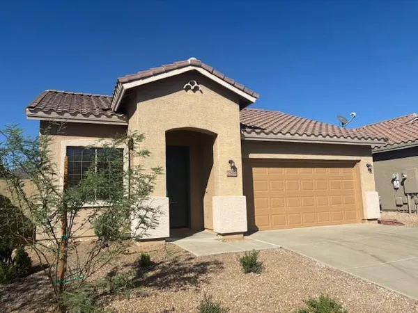 a front view of a house with a garage