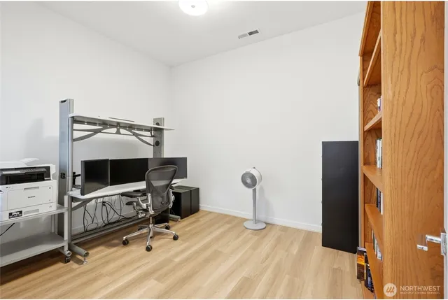 a view of a workspace with furniture and air conditioner