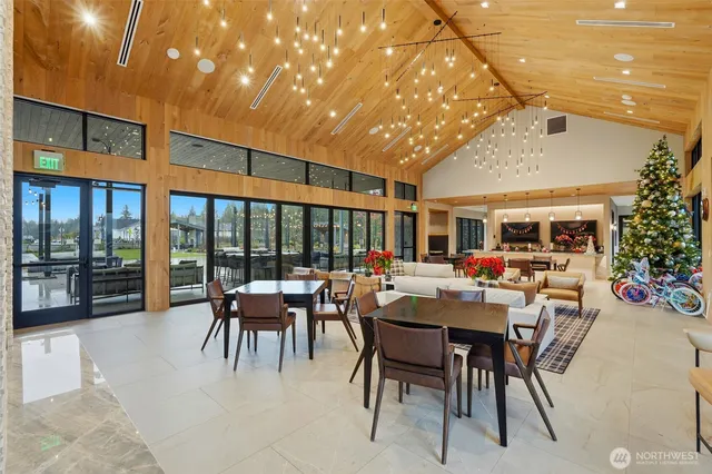 a view of a patio with dining table and chairs with garden view