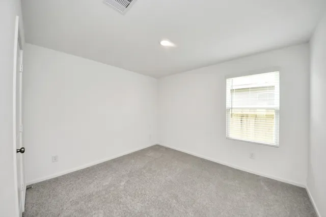 a view of a kitchen with a sink and cabinets