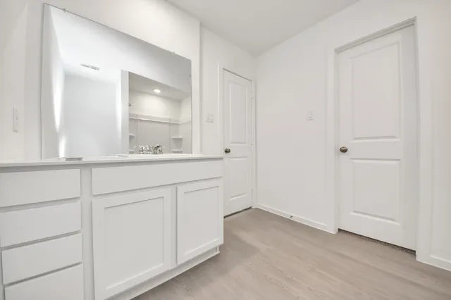 an empty room with wooden floor