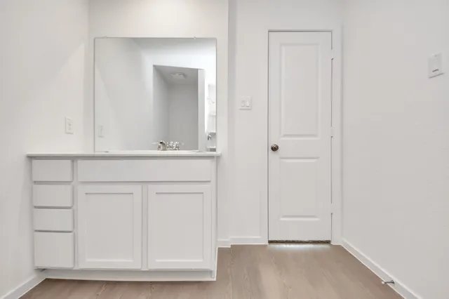 a view of a backyard with plants and a garden