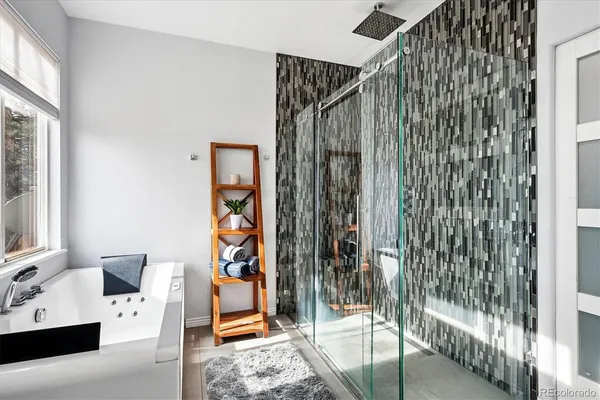 a view of a bedroom with a bed and a window