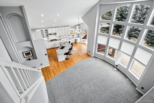 a view of living room with furniture and a floor to ceiling window