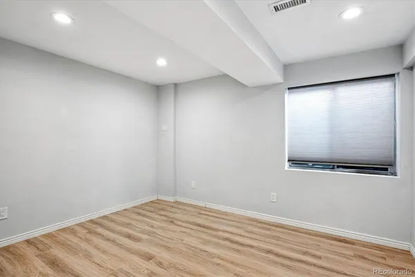 a view of balcony with wooden floor