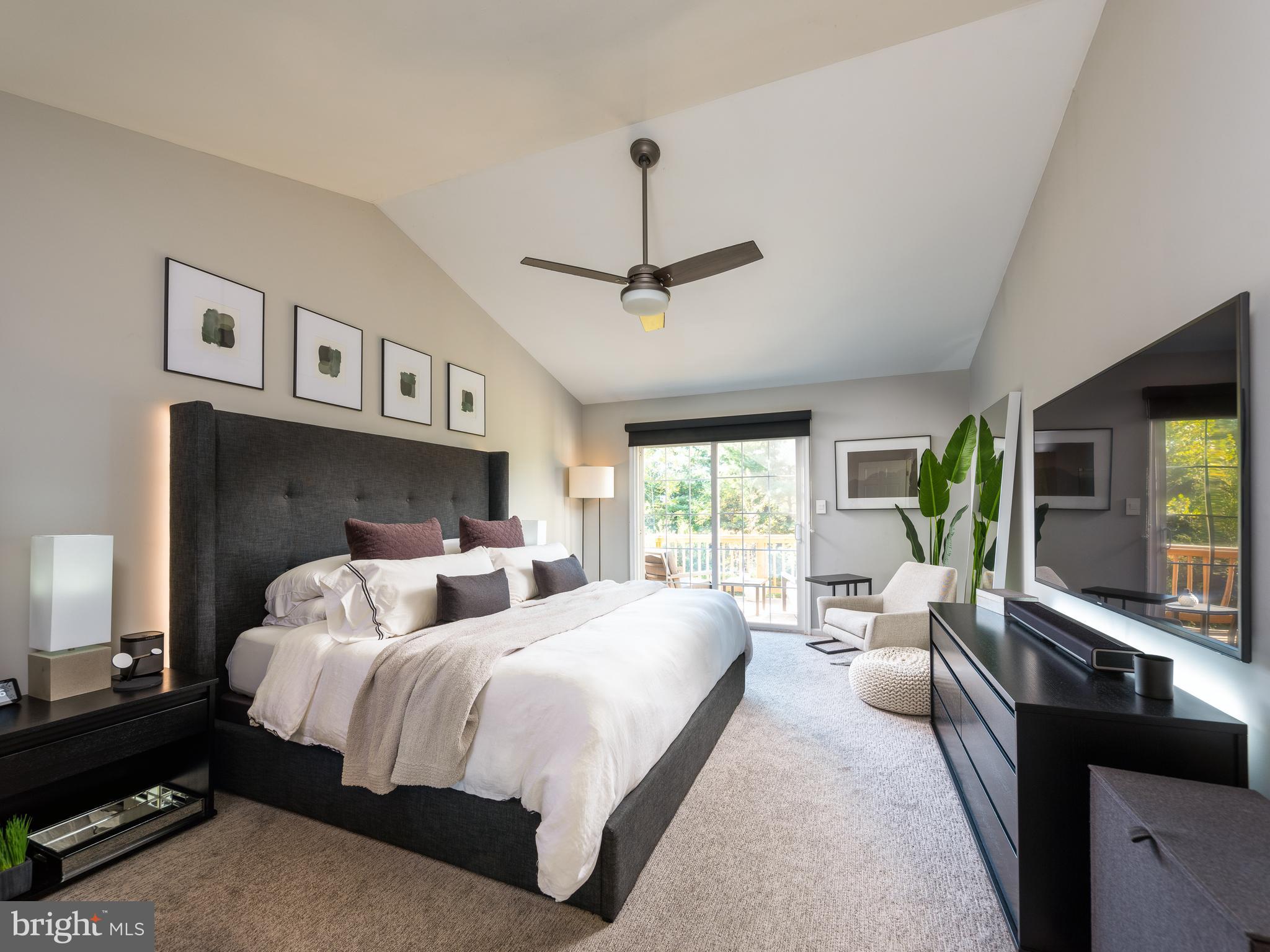 80 Dispatch Drive, Unit 97 Washington Crossing, PA 18977 - Photo 13 of 32 a bedroom with a large bed and a window