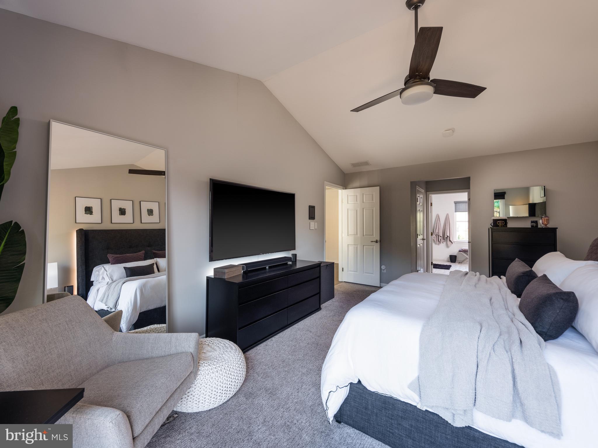 80 Dispatch Drive, Unit 97 Washington Crossing, PA 18977 - Photo 14 of 32 a bedroom with a bed and furniture