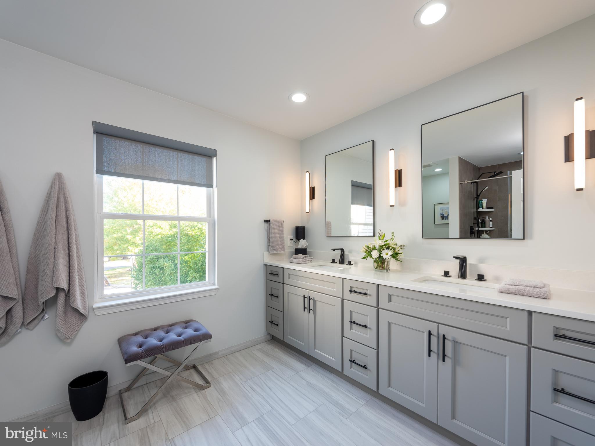 80 Dispatch Drive, Unit 97 Washington Crossing, PA 18977 - Photo 17 of 32 a spacious bathroom with a double vanity sink mirror and window