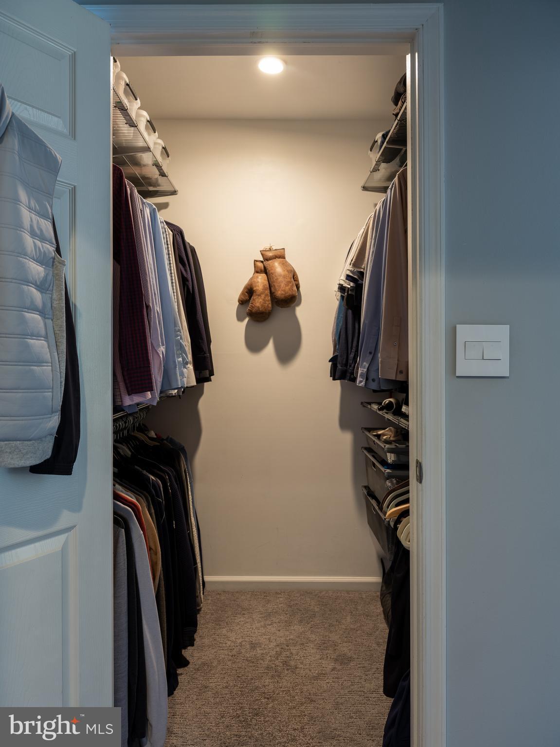 80 Dispatch Drive, Unit 97 Washington Crossing, PA 18977 - Photo 19 of 32 a view of walk in closet with clothes and shoes