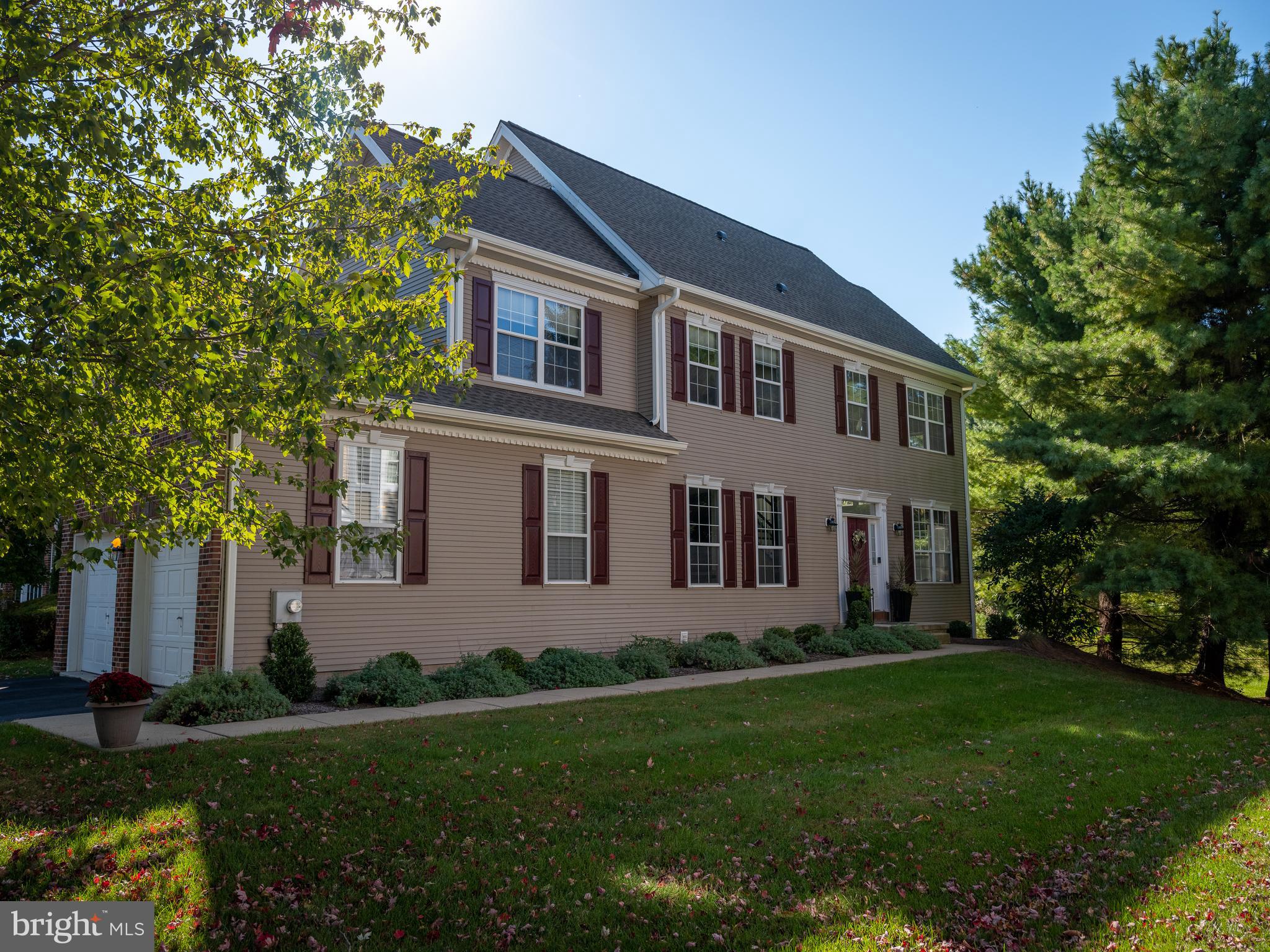 80 Dispatch Drive, Unit 97 Washington Crossing, PA 18977 - Photo 2 of 32 a front view of a house with a garden and yard
