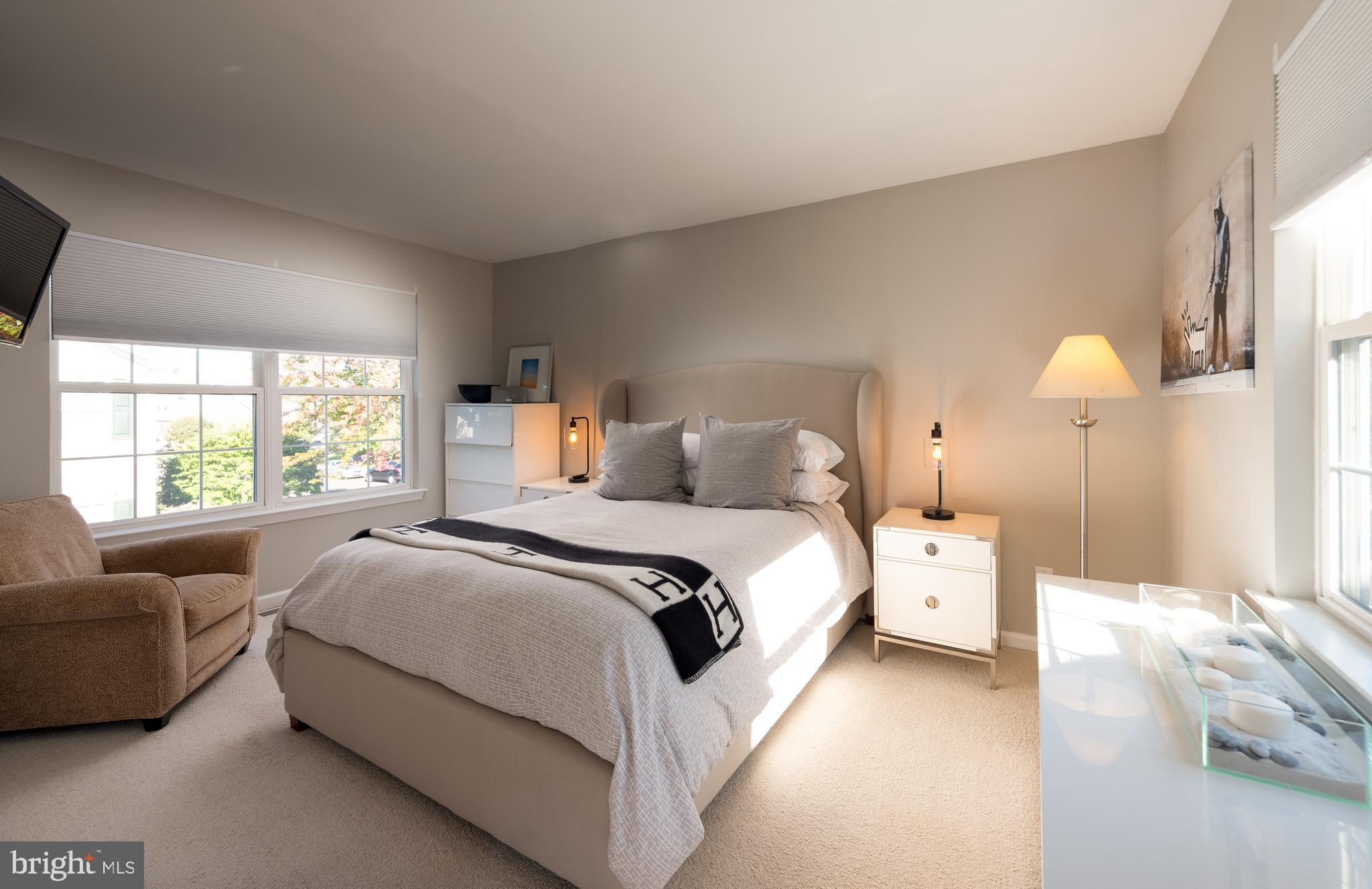 80 Dispatch Drive, Unit 97 Washington Crossing, PA 18977 - Photo 21 of 32 a bed room with a bed and a couch