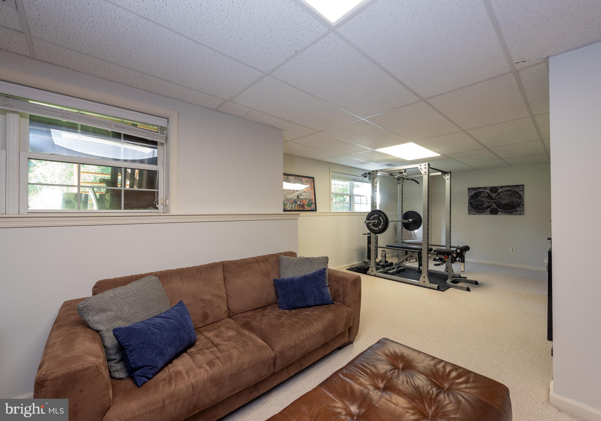 80 Dispatch Drive, Unit 97 Washington Crossing, PA 18977 - Photo 24 of 32 a living room with furniture and a window