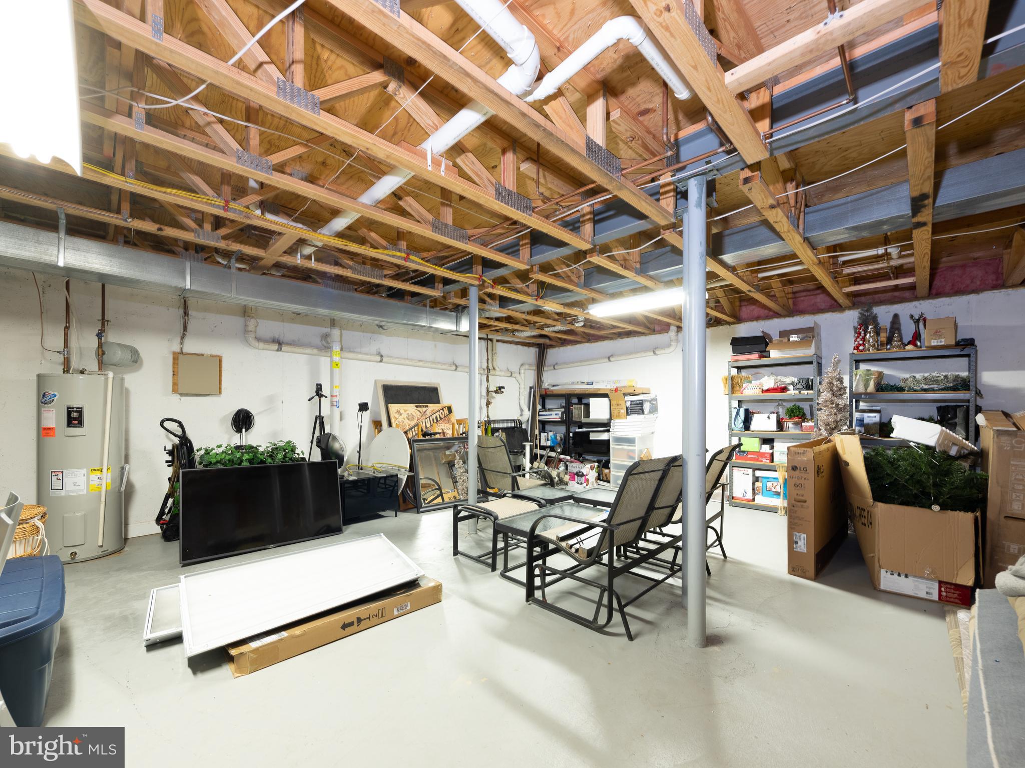 80 Dispatch Drive, Unit 97 Washington Crossing, PA 18977 - Photo 25 of 32 a living room with furniture and a flat screen tv