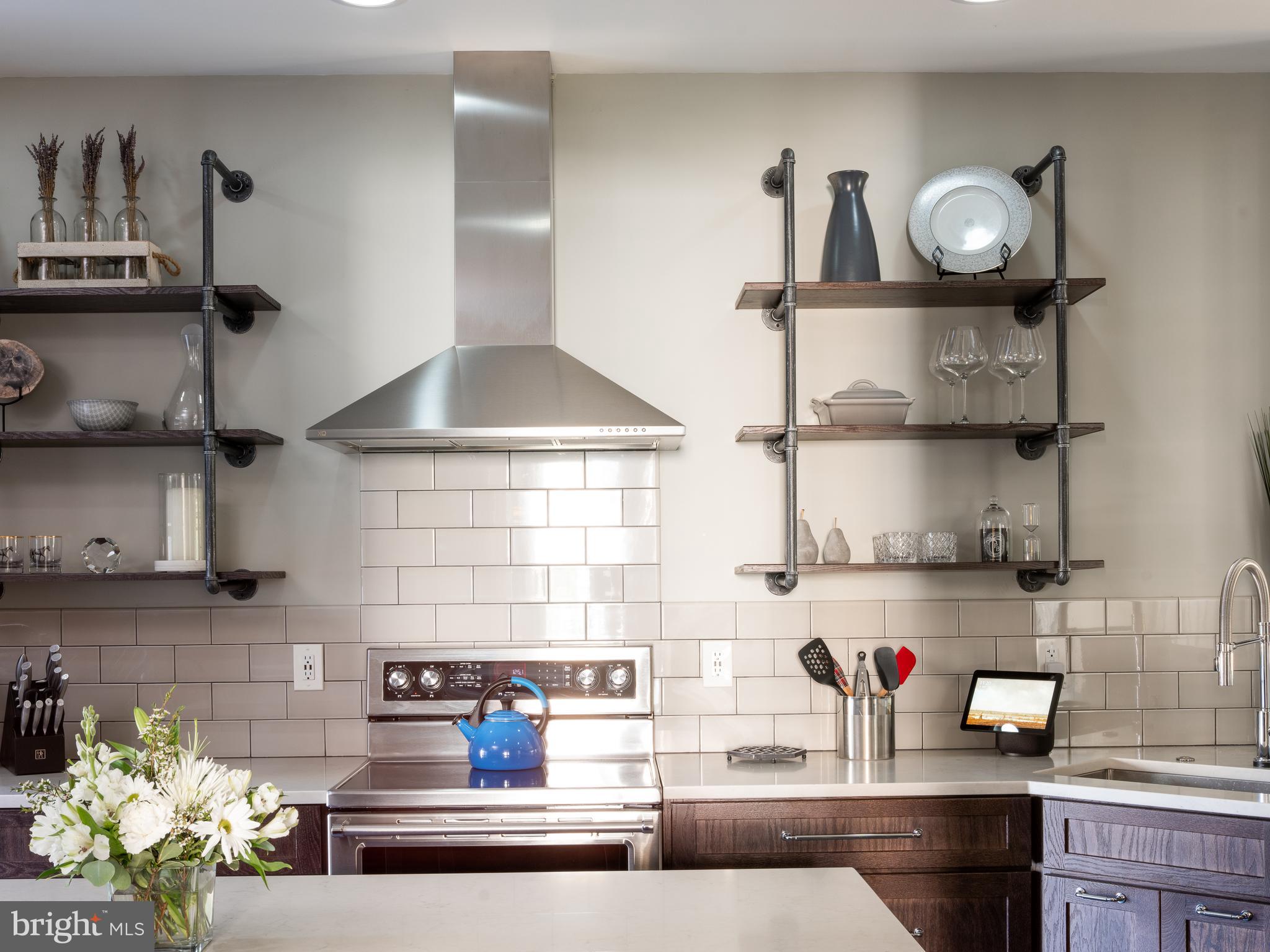 80 Dispatch Drive, Unit 97 Washington Crossing, PA 18977 - Photo 4 of 32 a kitchen with a cabinets and a stove