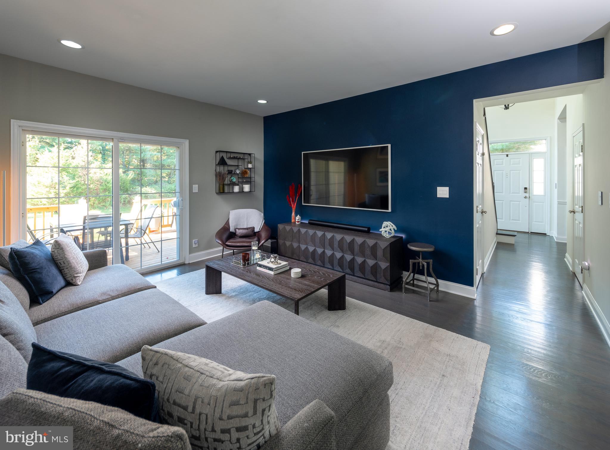 80 Dispatch Drive, Unit 97 Washington Crossing, PA 18977 - Photo 5 of 32 a living room with furniture and a flat screen tv