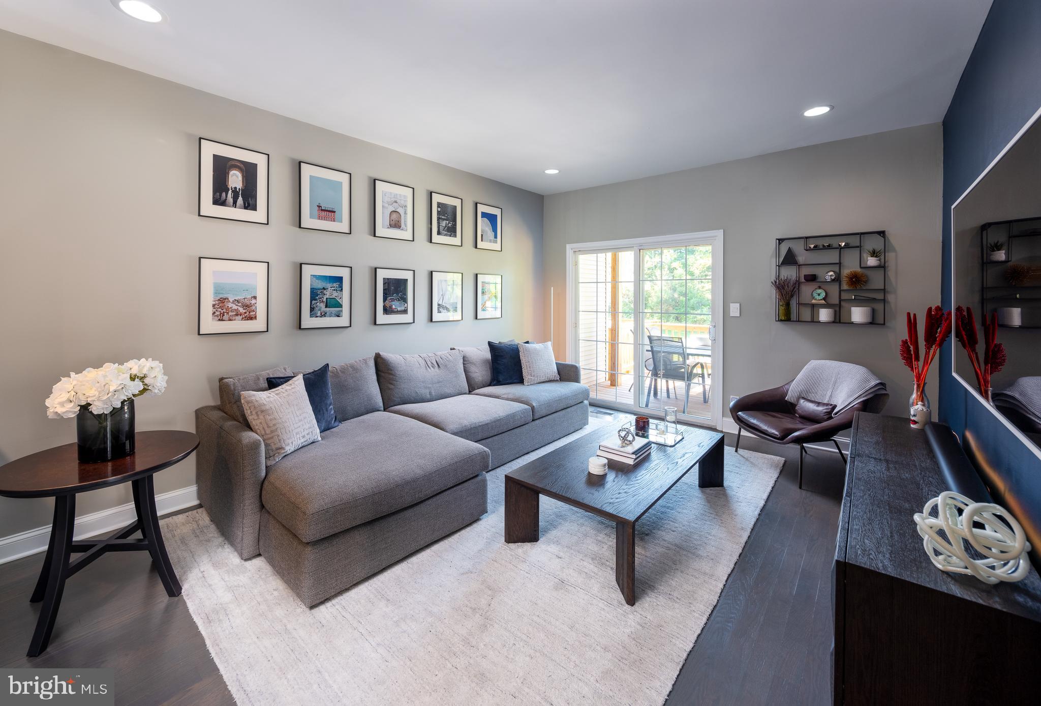 80 Dispatch Drive, Unit 97 Washington Crossing, PA 18977 - Photo 6 of 32 a living room with furniture a rug and a window