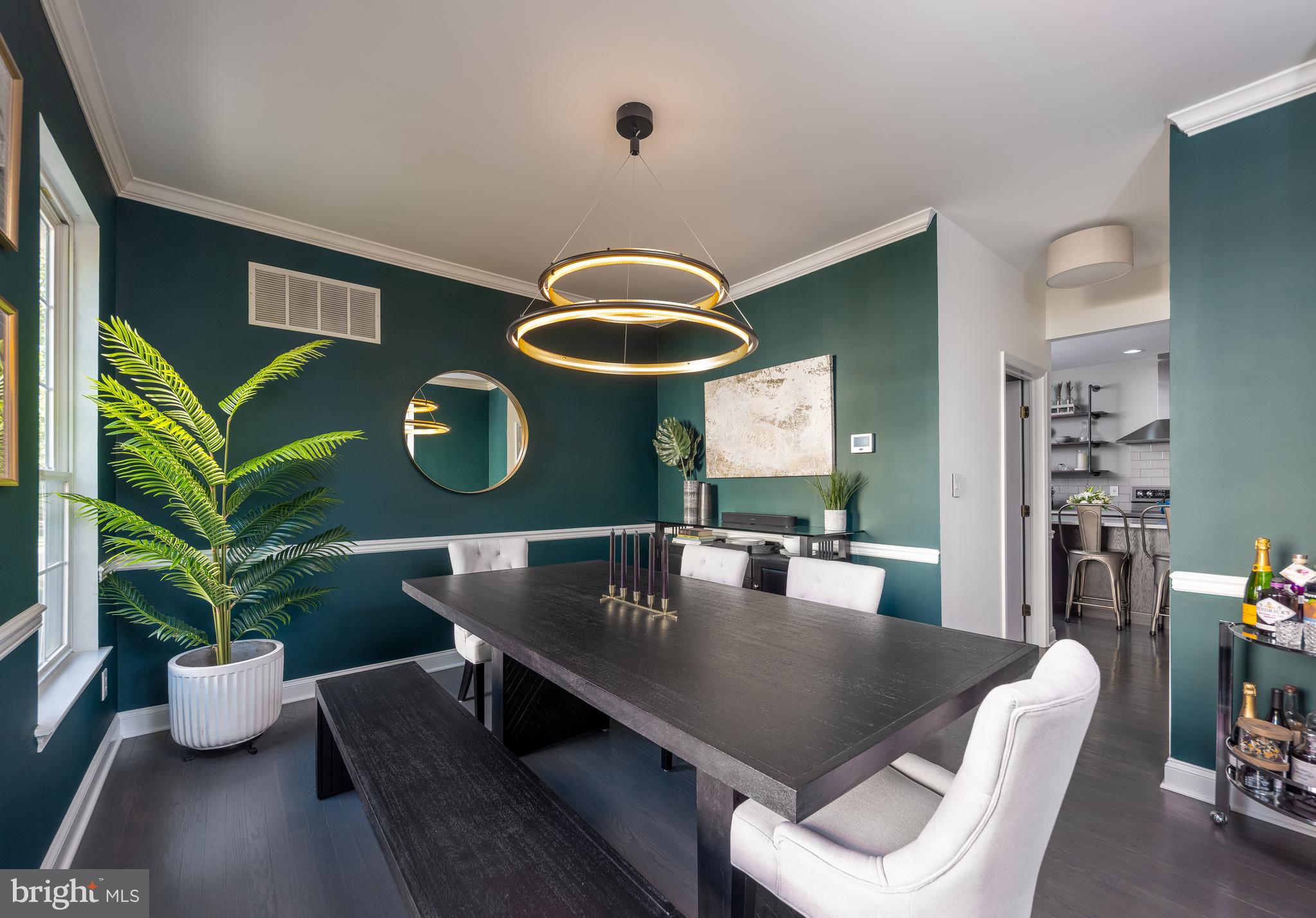80 Dispatch Drive, Unit 97 Washington Crossing, PA 18977 - Photo 8 of 32 a dining room with furniture and wooden floor