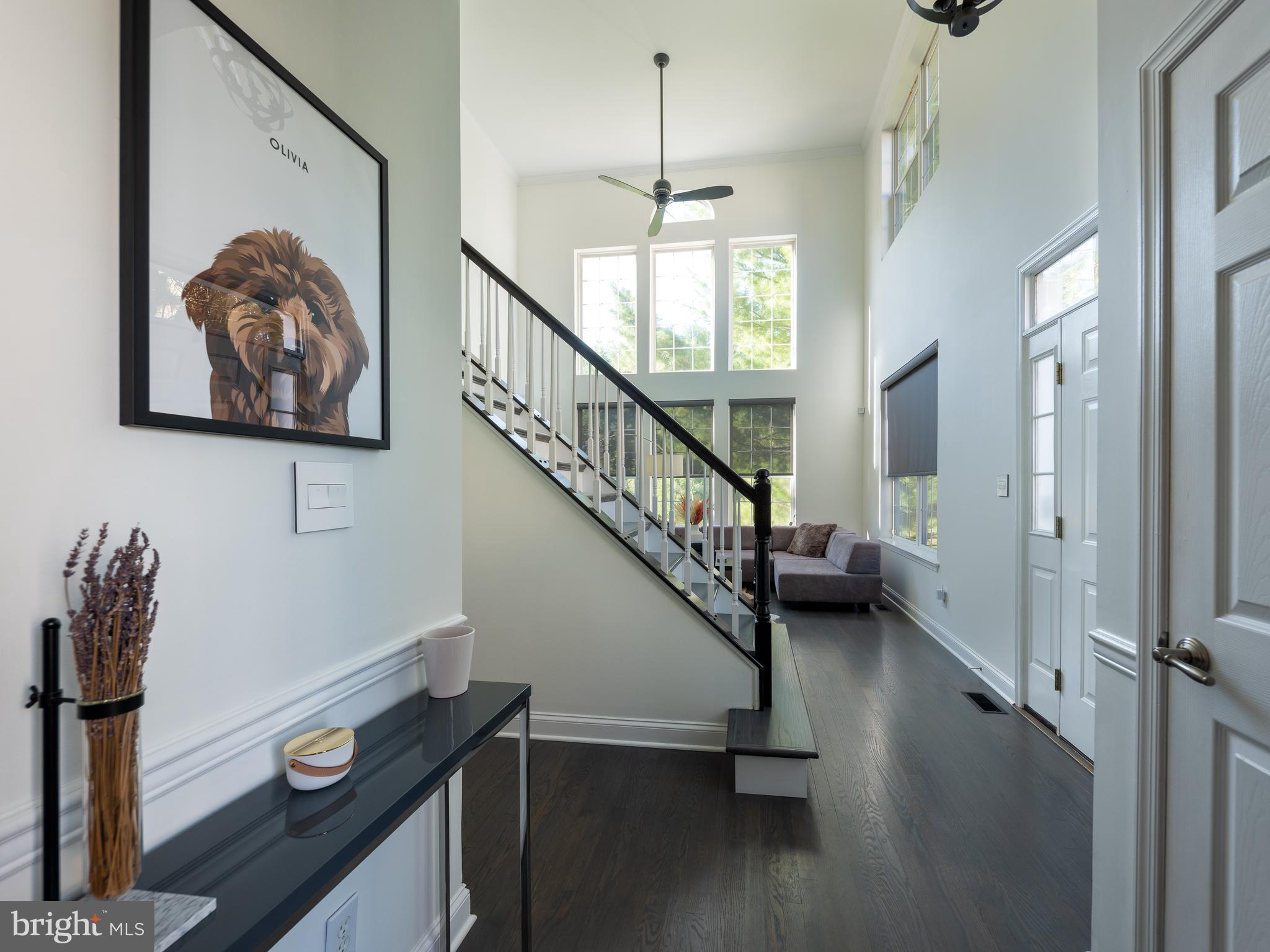 80 Dispatch Drive, Unit 97 Washington Crossing, PA 18977 - Photo 9 of 32 a view of entryway and hall with wooden floor