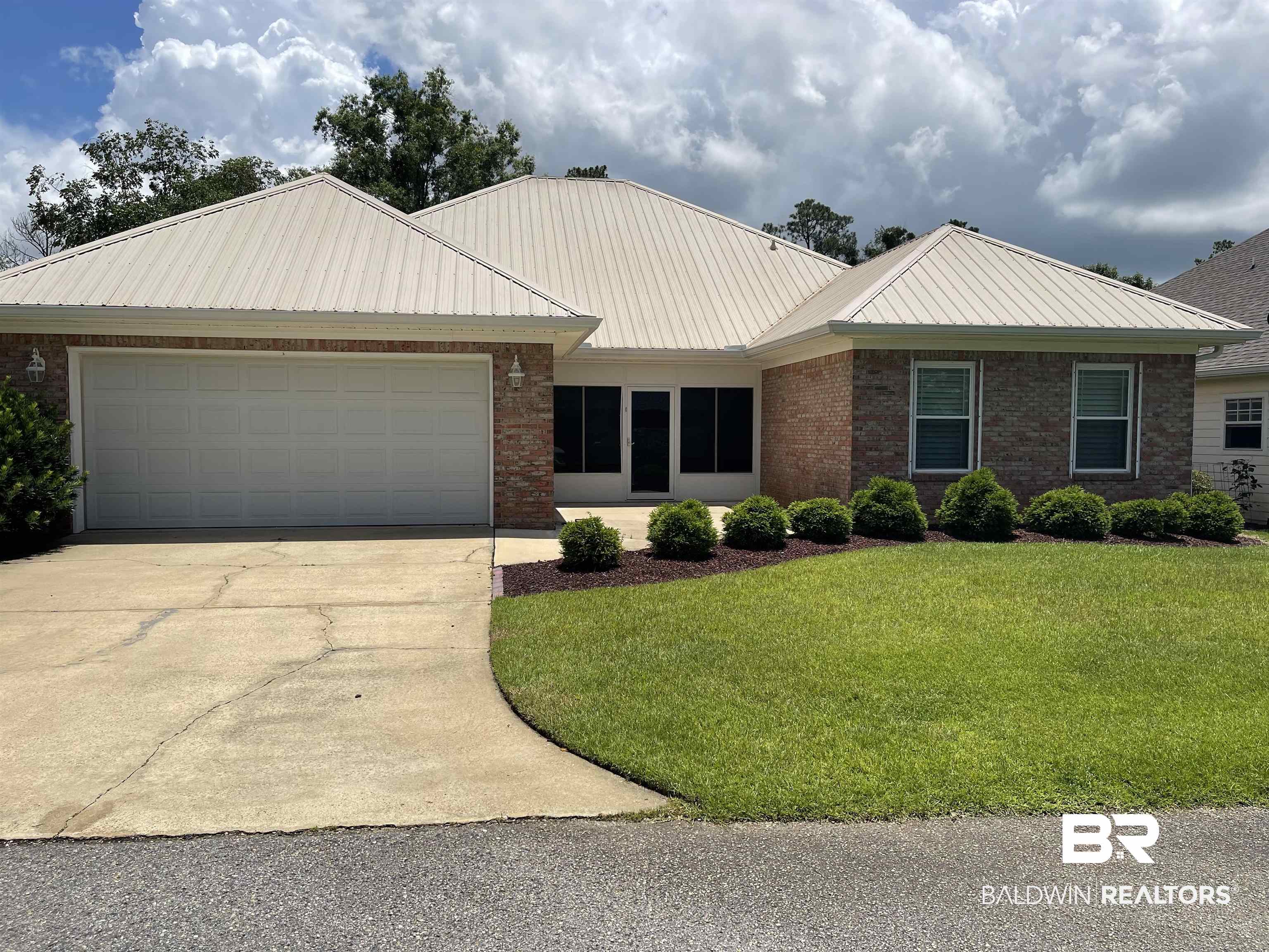 210 Savannah Circle Foley, AL 36535 - Photo 2 of 18 Ranch-style home featuring a front lawn and a garage
