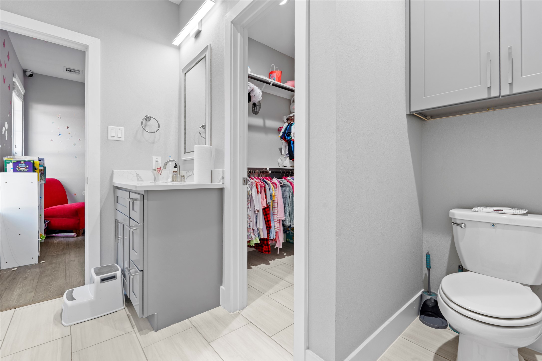 6207 Graff Net Court Spring, TX 77379 - Photo 14 of 49 Generous closet with built-in cabinets above the toilet for extra storage!