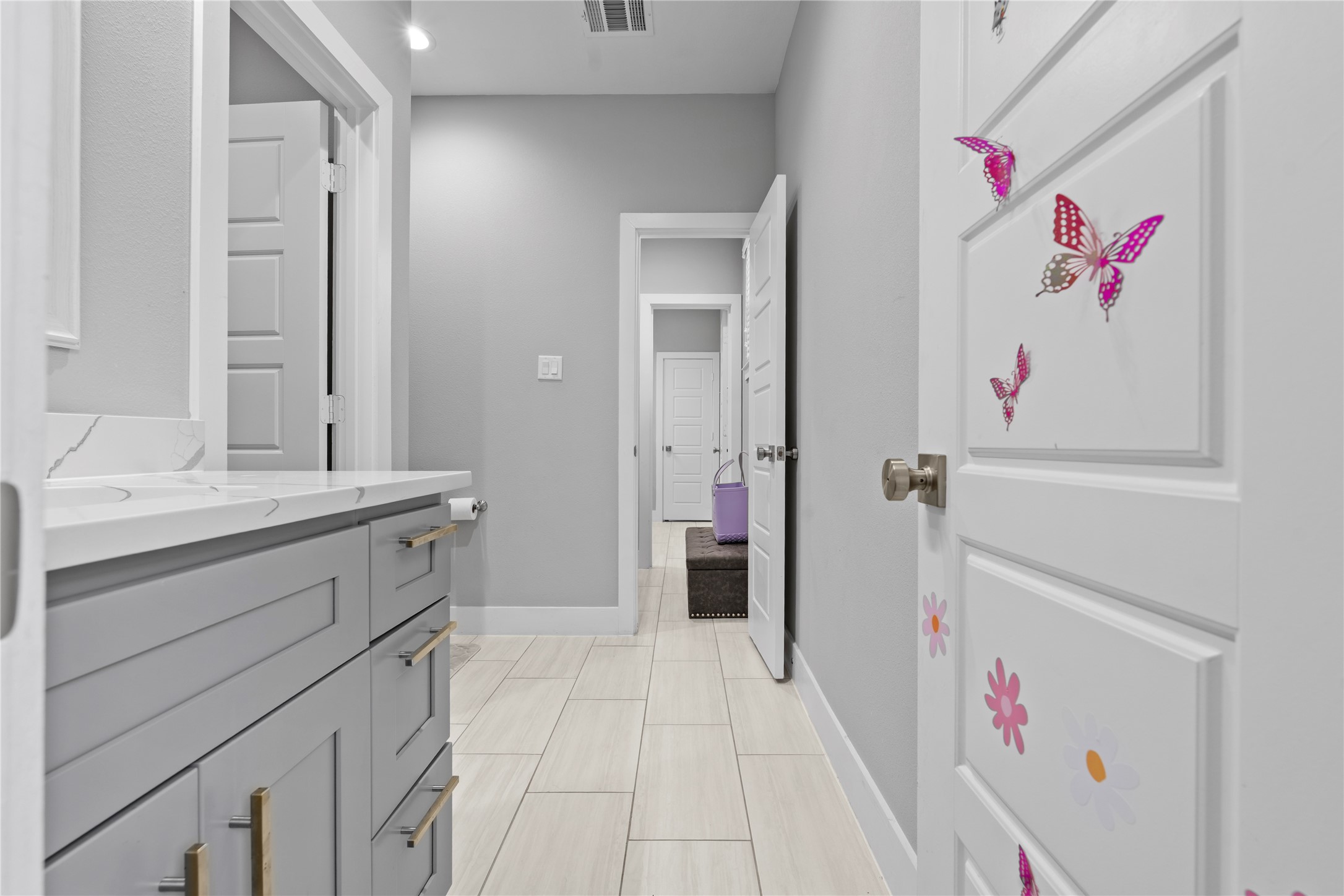 6207 Graff Net Court Spring, TX 77379 - Photo 15 of 49 Stylish grey cabinets with elegant gold accents.