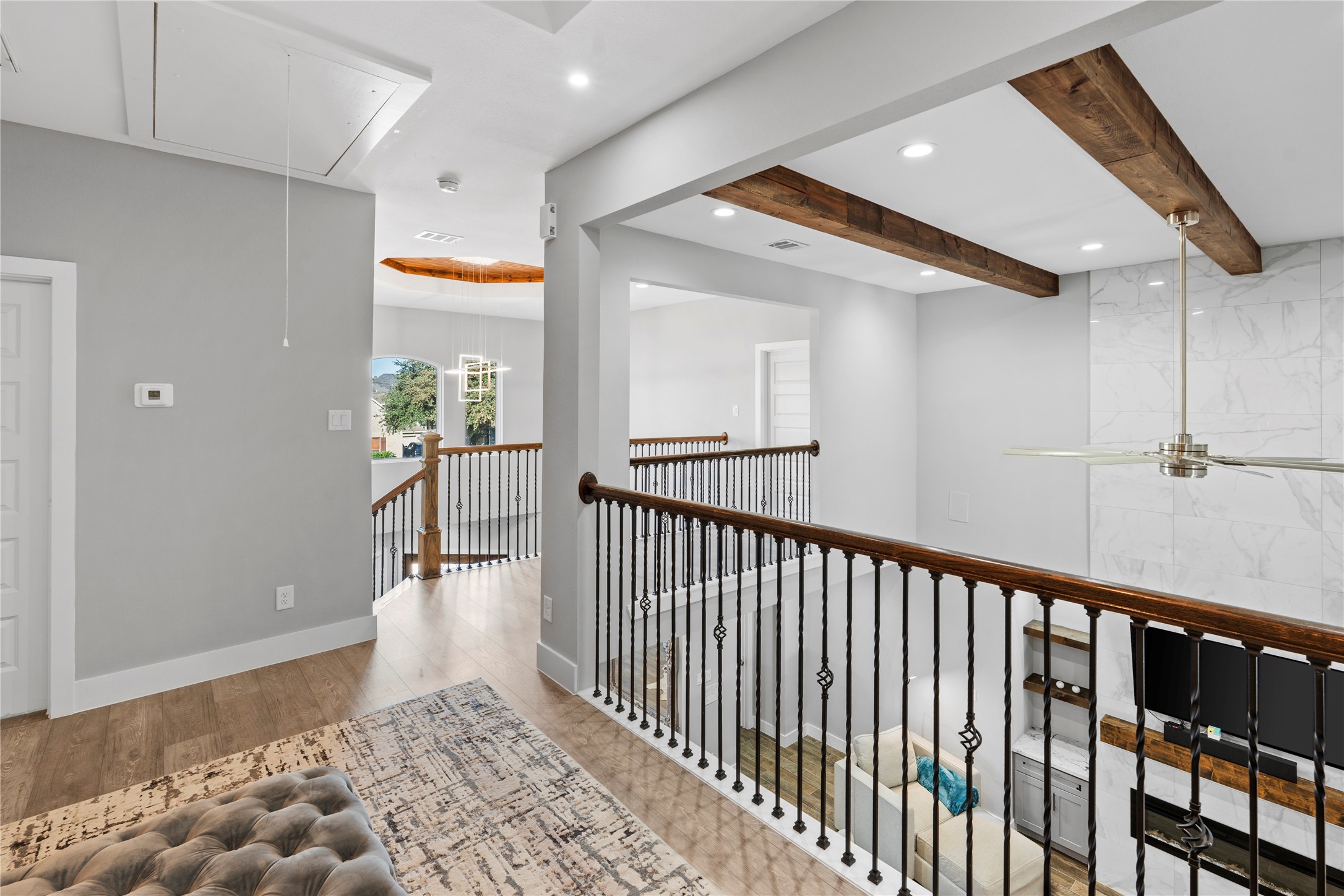 6207 Graff Net Court Spring, TX 77379 - Photo 32 of 49 Upstairs railing view overlooking the elegant living area below.