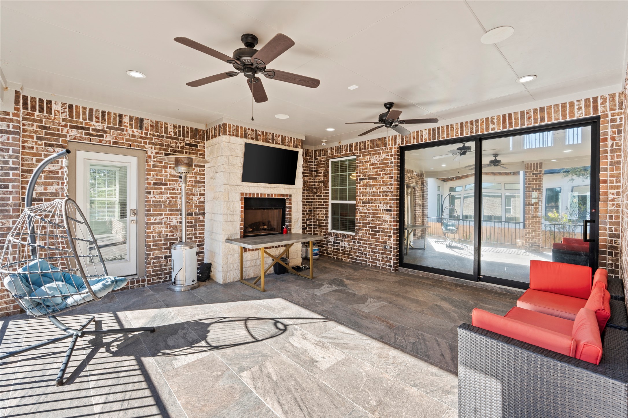 6207 Graff Net Court Spring, TX 77379 - Photo 43 of 49 Lifted covered patio with fans and doors opening to your living room and fireplace, the perfect hangout spot you’ll never get tired of!