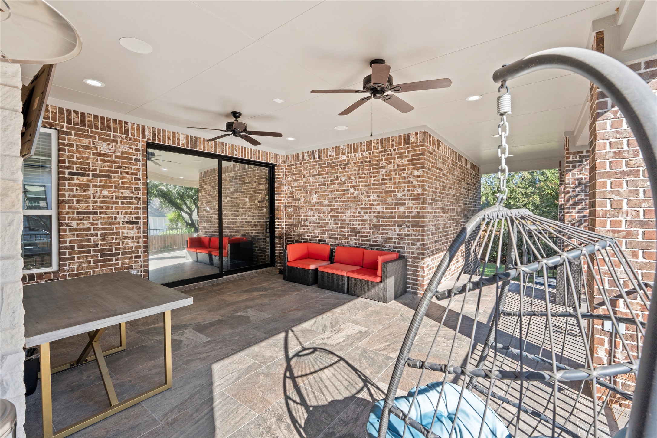 6207 Graff Net Court Spring, TX 77379 - Photo 9 of 49 Shaded outdoor patio with fan for comfortable year round enjoyment.