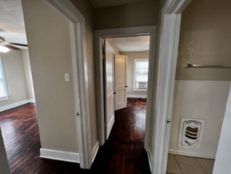 301 Cardinal Street San Marcos, TX 78666 - Photo 5 of 9 Hallway with dark wood-style flooring