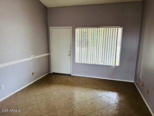 4044 East Carson Road Phoenix, AZ 85042 - Photo 18 of 22 a view of an empty room with a window