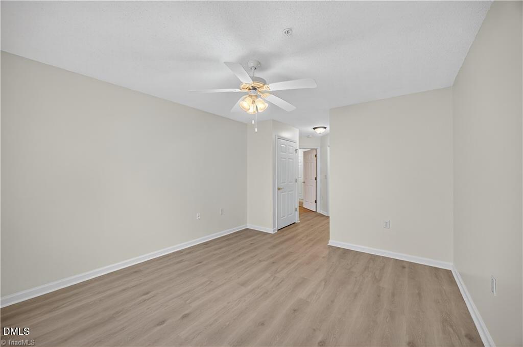 2221 Delaney Drive, Unit 114 Burlington, NC 27215 - Photo 16 of 18 wooden floor in an empty room