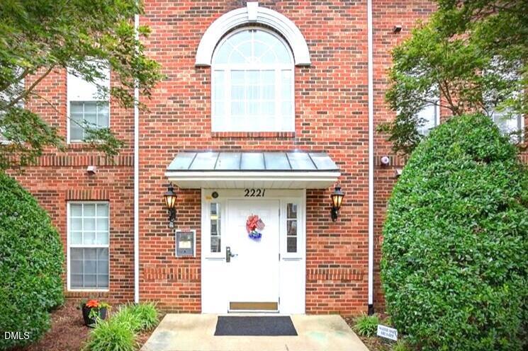 2221 Delaney Drive, Unit 114 Burlington, NC 27215 - Photo 18 of 18 a front view of a house with a garden