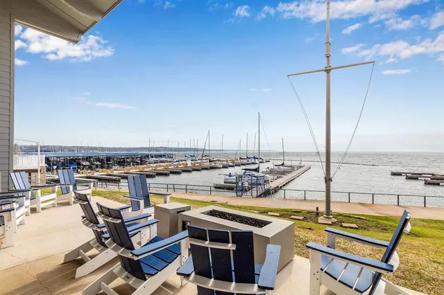 a view of a balcony with chairs