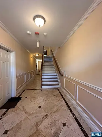 a view of a hallway with staircase